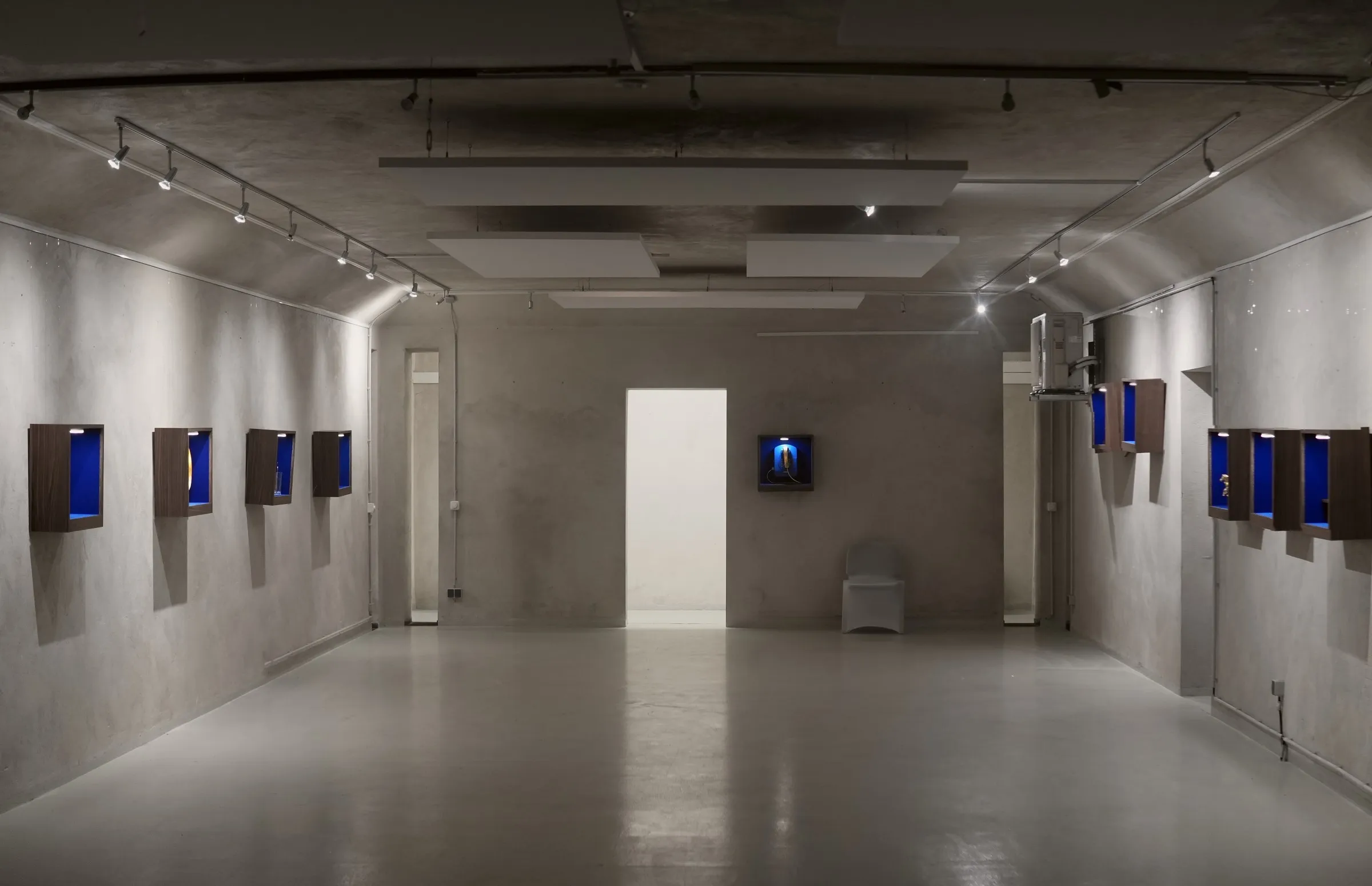 Exhibition room at Bunker West with the ten vitrines